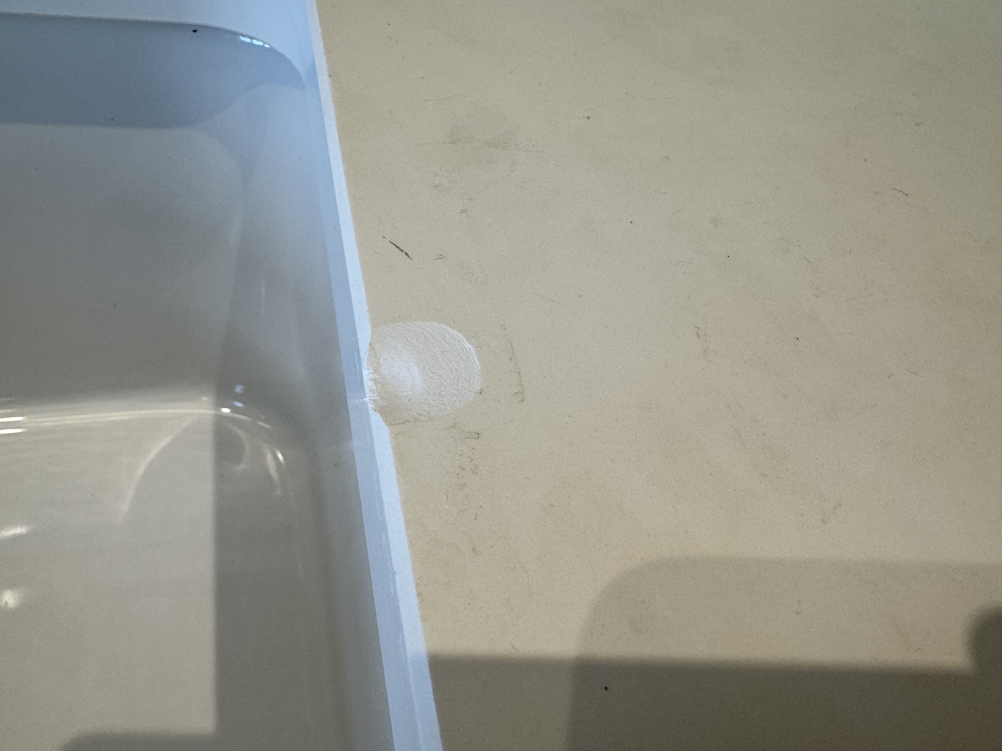 Damaged white quartz worktop.