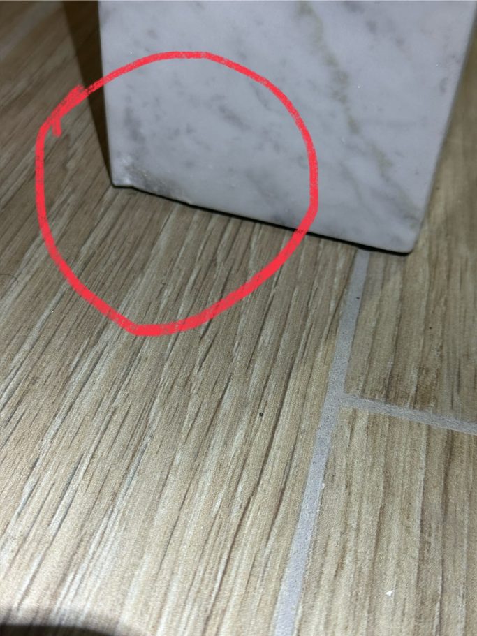 Before repair: chipped marble table base Marble table base damaged on the edge, needs repairing with same coloured resin. Repair for Barker and stone house in leeds.