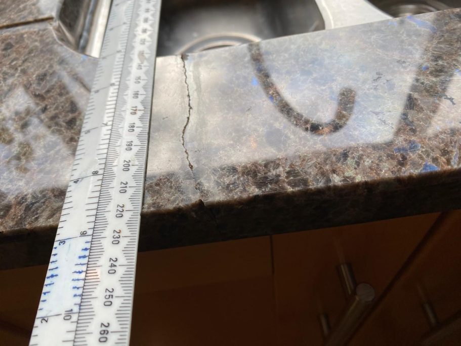 Before repair: cracked granite in Huddersfield Cracked granite worktop. Picture showing the damaged granite kitchen worktop. This needs re leveling and then re polishing.