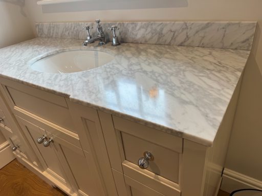 Polished Carrera white marble top White Carrera marble top showing the finished polish and all stains removed.