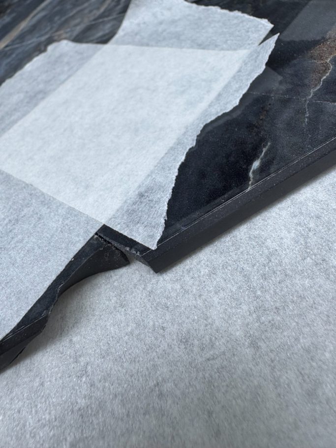 Stone tabletop prepared for bonding and filling Stone tabletop sections prepared for bonding and filling.