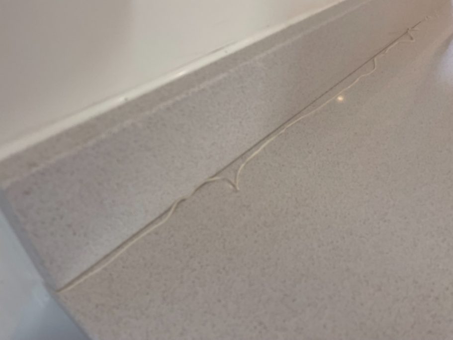 Quartz joint requiring fresh sealant silicone needs renewing