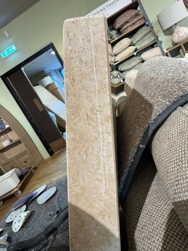 Travatine table scratched. Edge of table with a deep scratch all down the side. This needs re-sanding to remove scratch.