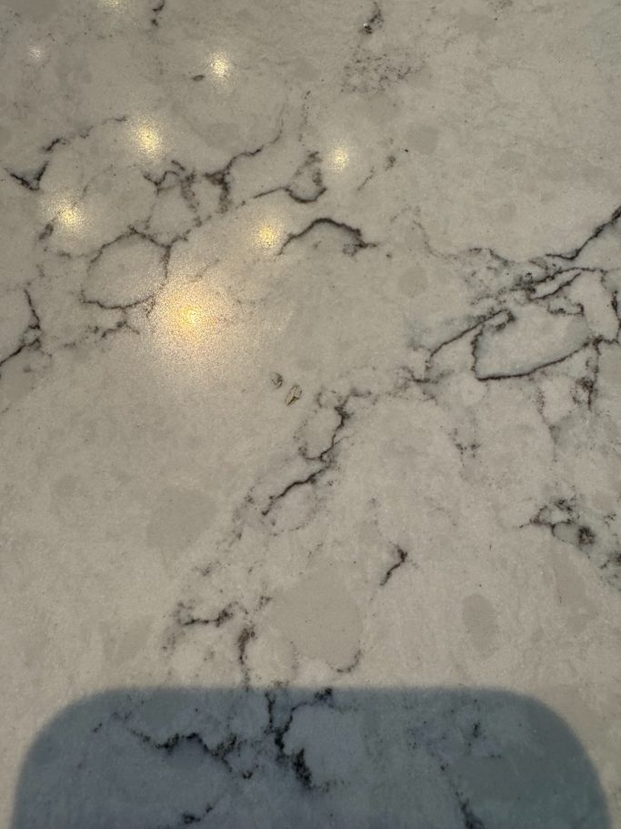 After repair: filled chips in white quartz repaired white quartz kitchen worktop as you can see the holes in the surface have been filled with resin.