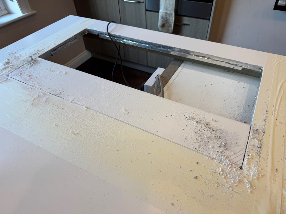 Corian island prepared for restoration Corian worktop damaged in the leeds area. Island bar showing preperation of the corian to be cut and polished on site.