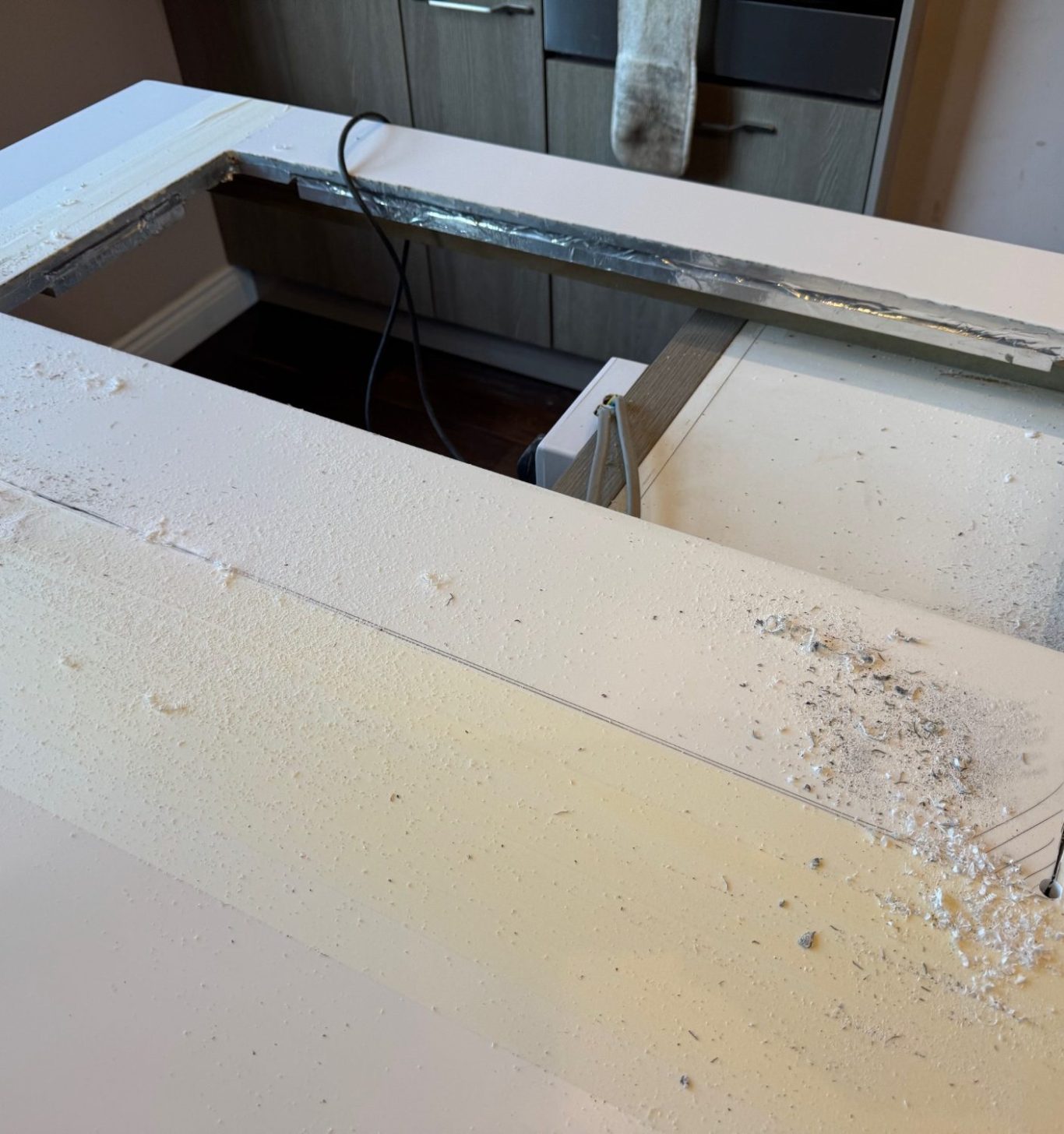 Picture showing the islandbar with the old hob removed. The cut out needed to be made bigger for the new induction hob.