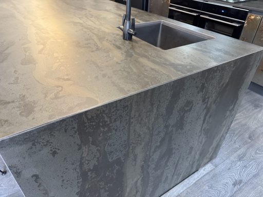 After: restored island bar Dekton island bar after edge and corner repairs using colour-matched resin and gold flecks in Dodworth, Barnsley.