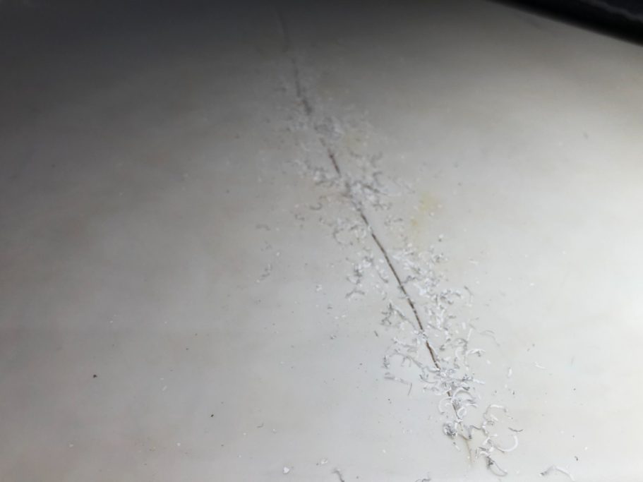 Before repair: cracked and stained Corian Discoloured corian worktop. Corian cracked on the surface , needs filling and sanding, Job repaired to a high standard and could not tell.