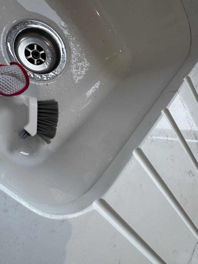 After repair: restored quartz sink edge Granite quartz worktop in huddersfield was repaired at the edge of the draining groove area.