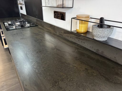 After: levelled and bonded Re-levelled Dekton worktop with a freshly bonded rear upstand joint in Dodworth, Barnsley.