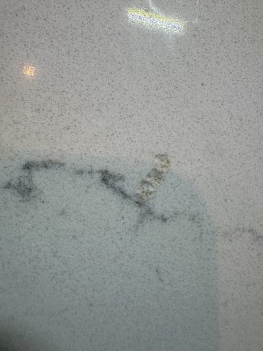 Worktop Repair was carried out in Leeds, the surface had to be filled and sanded down to a smooth finish. If you look close at this picture, you will see a damaged marble Carrera White worktop at the Grey vein, this had a wine bottle dropped on i