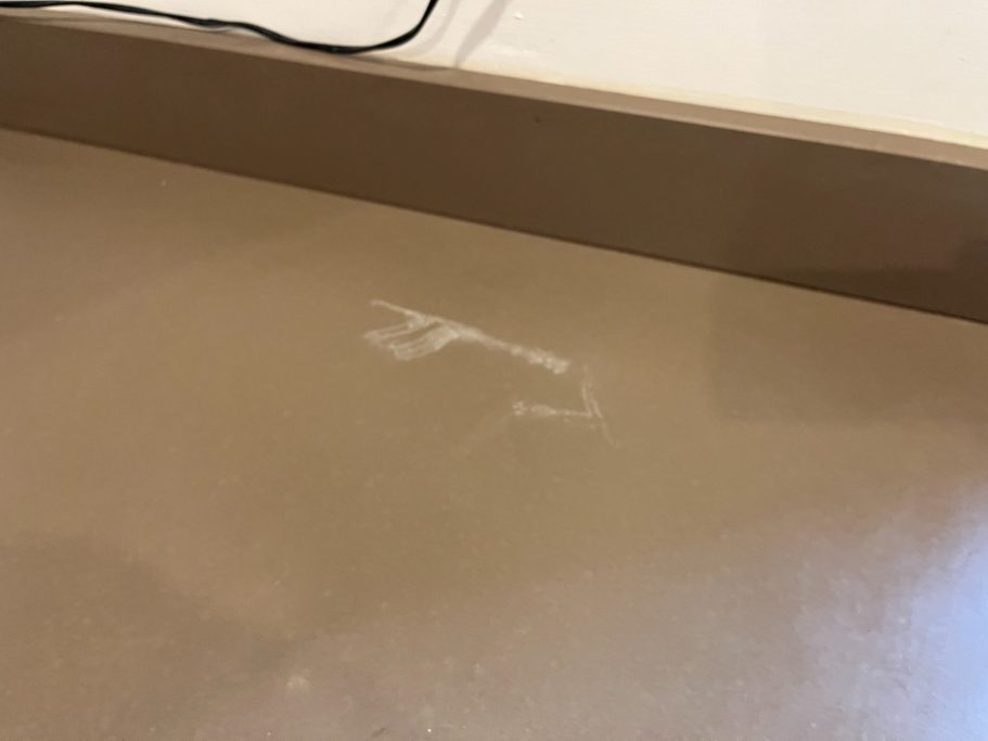 Before restoration: marked brown quartz Quartz worktop in huddersfield marked and scuffed on the surface. The quartz surface needed fully polishing to remove mark.