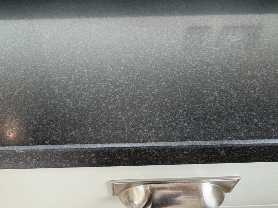 After restoration: refinished honed black granite Natural honed black granite worktop, refurbished in the Leeds area.