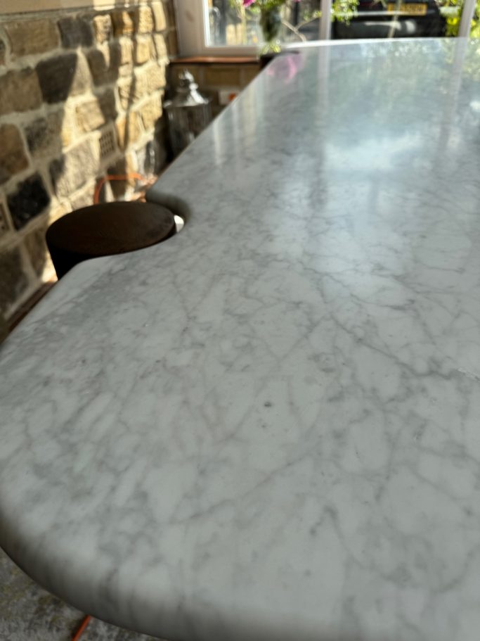 After restoration: repolished marble in Garforth Marble table from barker and stone house had a circular stain on the polished surface. Finished polish on the marble table.