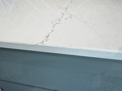Close-up of quartz worktop repair on then edge and the surface, this had to be colour matched with resin.