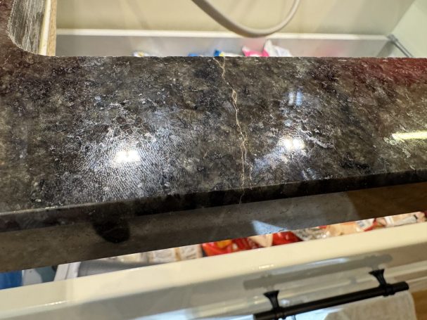 Before: cracked hob cut-out Crack across the front of the Ubatuba granite hob cut-out before repair in Hebden Bridge.