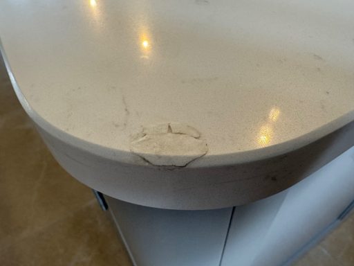 Granite and quartz worktops ltd at huddersfield took apicture of a repair done by the customer, super glue was used and a untidy job.