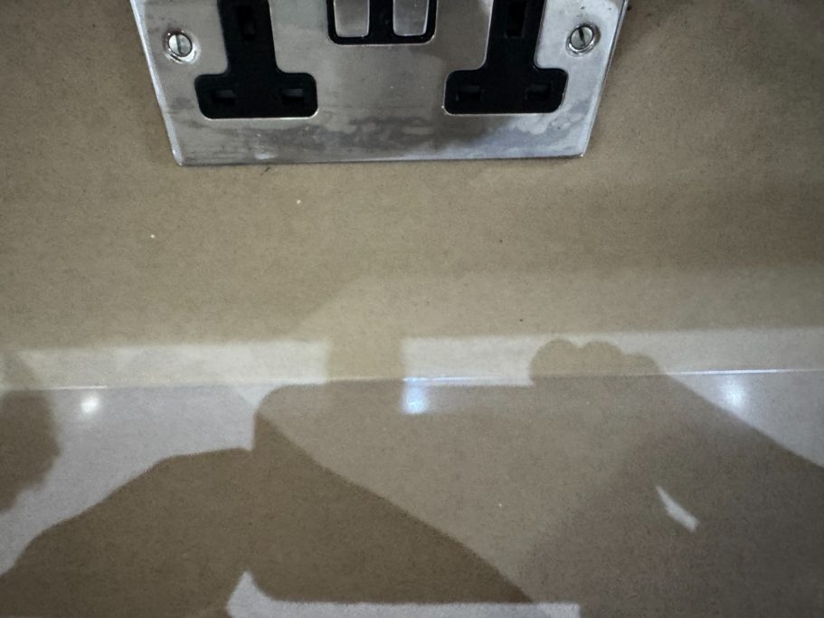 After repair: renewed granite joint seal This granite worktop has now been re-siliconed at the joint with new clear silicone using anti-mould.