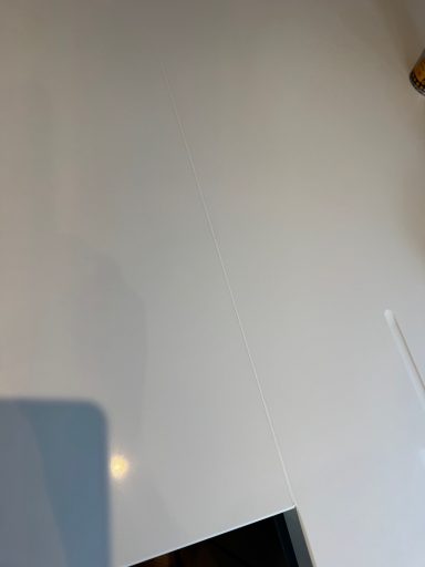 White corian worktop fully restored. The corian joint had a certain shade of silicone sealer put back in to match the existing counter top.