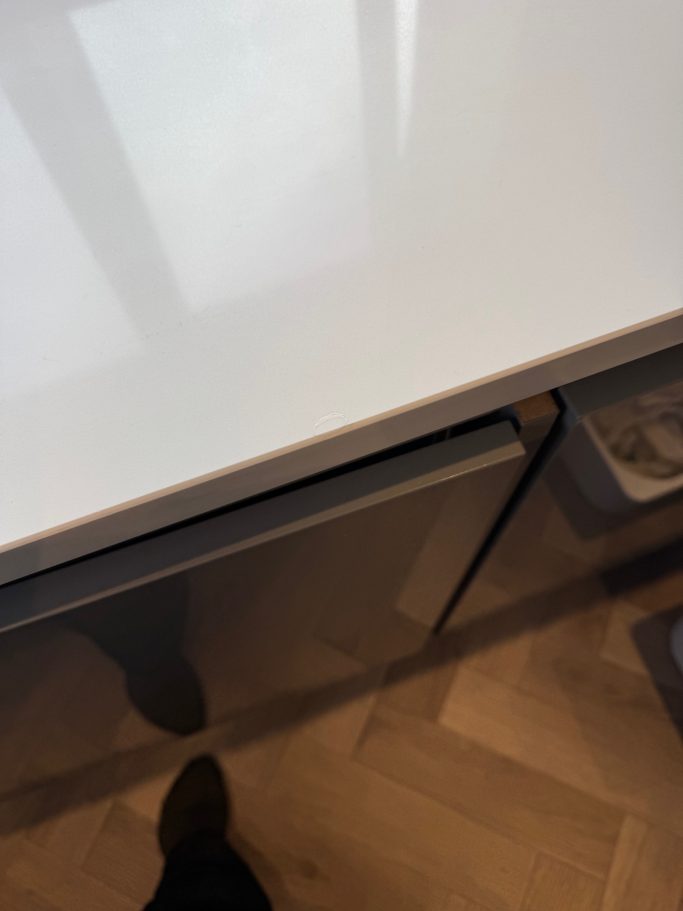 After repair: restored white quartz worktop Fully repaired white quartz kitchen worktop in huddersfield area. Resin was put in then sanded to match the polish of the existing top.