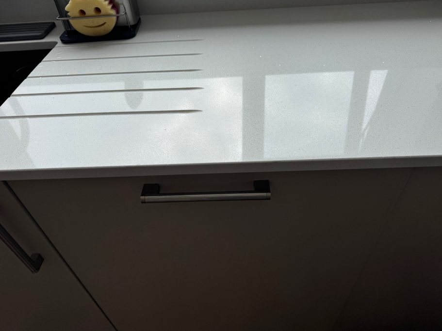 After repair: restored quartz in East Ardsley Repaired quartz worktop in East Ardsley. The repair was made with a resin filler on the edge and on the surface, then repolished.