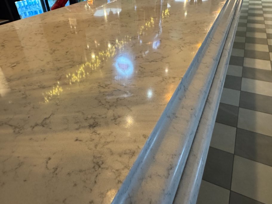 Refinished restaurant bar top Marble worktop repolished in a bar area. Marble was scratched and pitted.Marble worktops reaired in halifax.