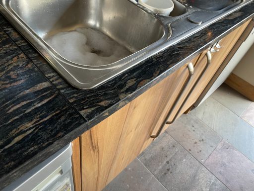 Repaired granite worktop in huddersfield. Picture showing broken granite re-fitted to the front and compleley restored perfectley.