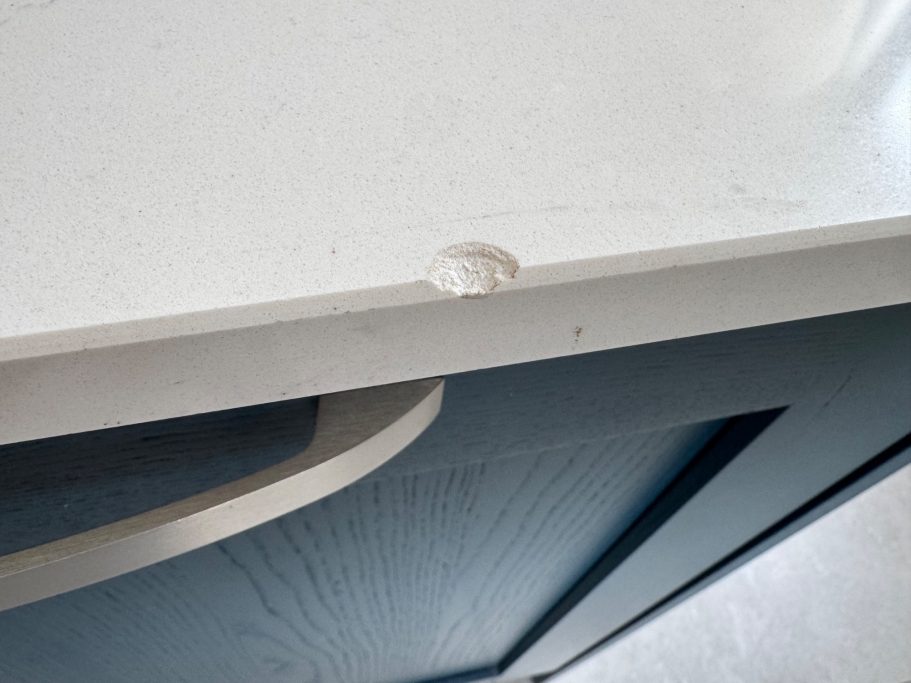 "Worktop chipped at the front edge White quart worktop damaged in Sheffield, West Yorkshire