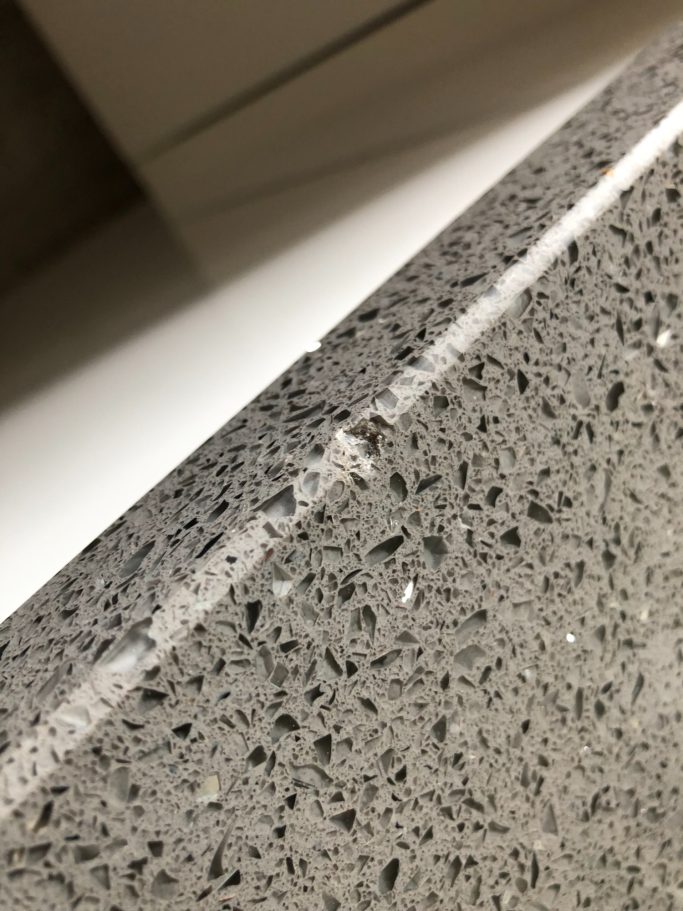 Before repair: damaged grey quartz Damaged grey quartz repair