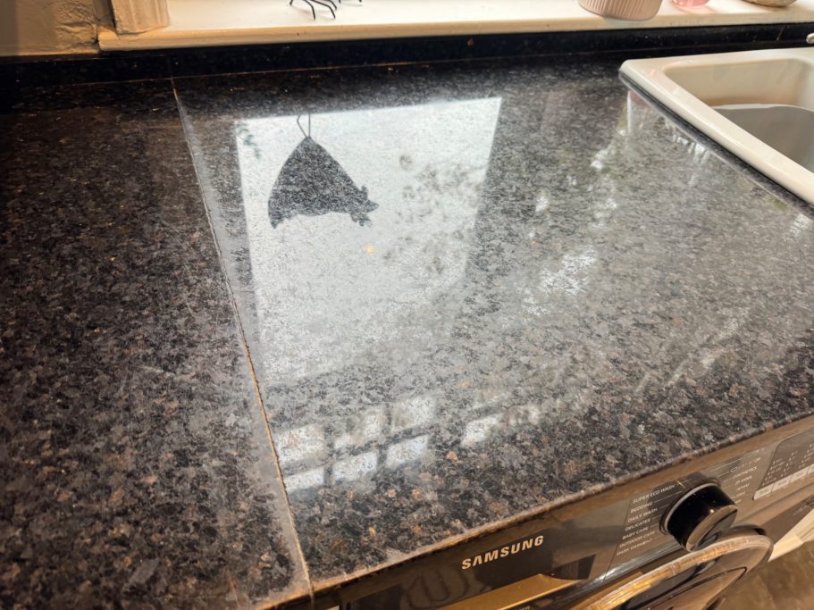 Before restoration: dull granite sink area in York Granite worktop in York needed a full restoration as the granite had deteriorated overtime. The surface looked really dull.