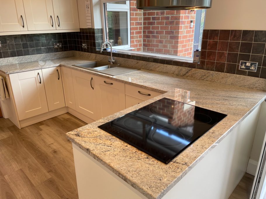 After treatment: restored granite surface Oil removed from natural stone kitchen worktop.