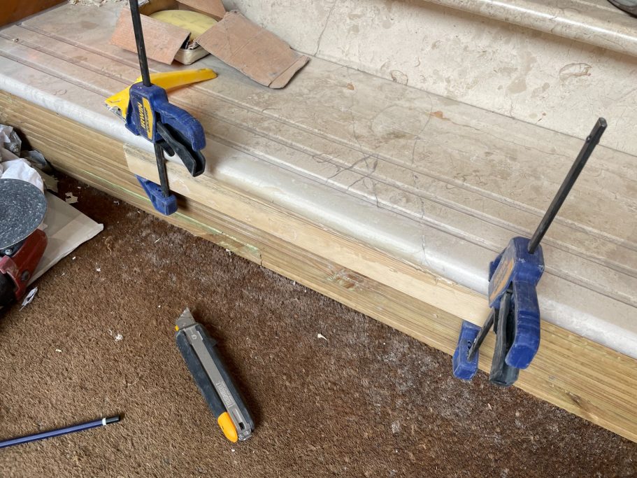 Marble sections clamped during bonding Refurbishing marble.