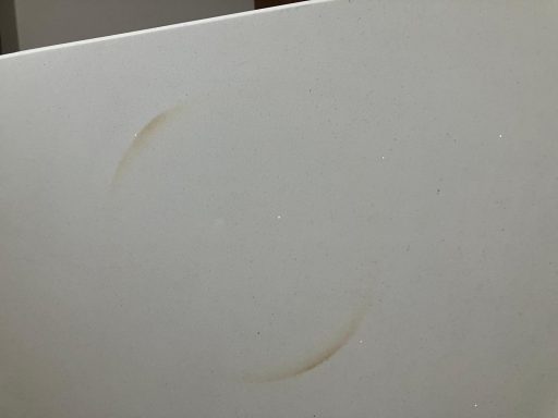 Quartz worktop burnt on the surface with a red hot pan from a gas hob. A circle shows the burnt quartz top. This needs re-sanding .