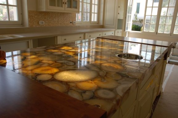 Backlit quartz island bar had pitted and chipped areas on the surface. The island bar needed repairing and repolishing, job in Spofforth.