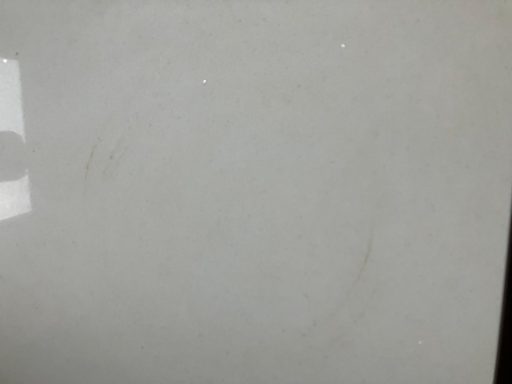 Quartz worktop repair showing a burn mark which had to be sanded to get the cicle shape out. It was very deep.