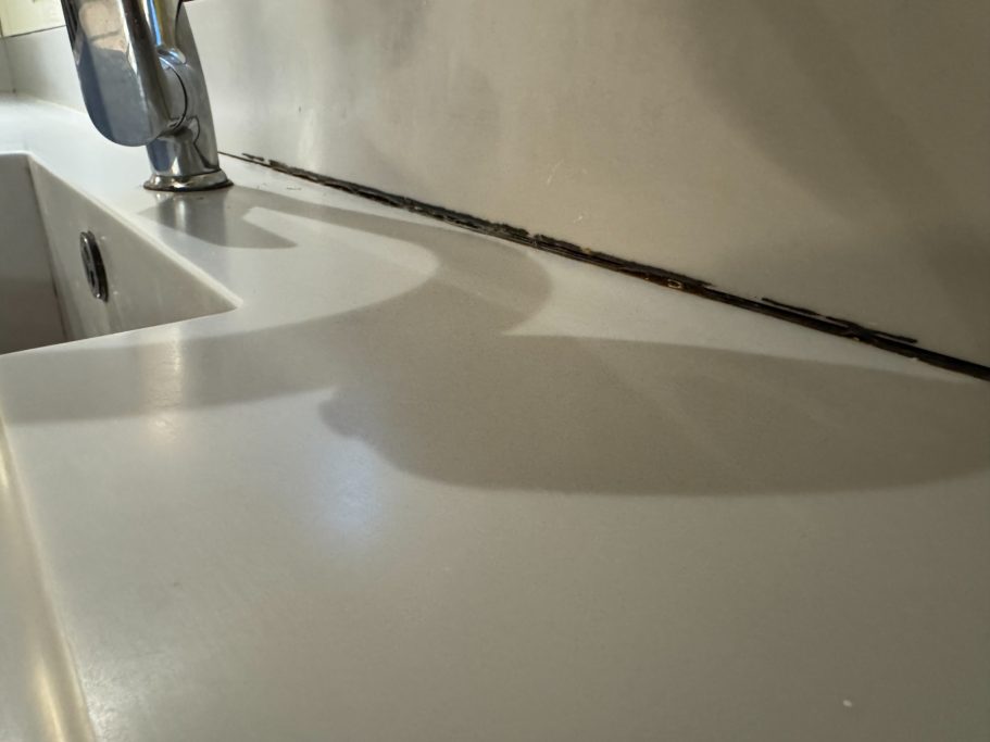 Corian joint requiring assessment Sagging corian work surface.
