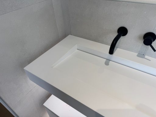 Finished vanity corian top in bathroom. Picture showing the finished repair at the corner which was cracked from corner to corner.