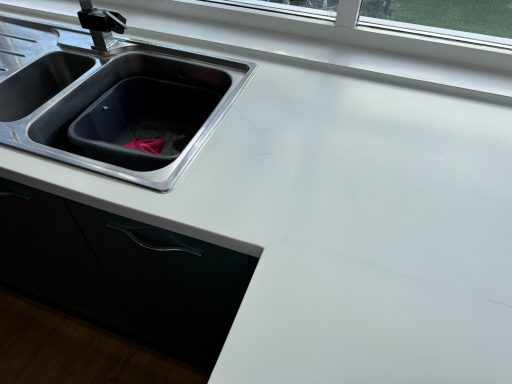 Finished corian worktop repair at the joint. Water damage caused the corian split because ot water swelling the wood underneath.