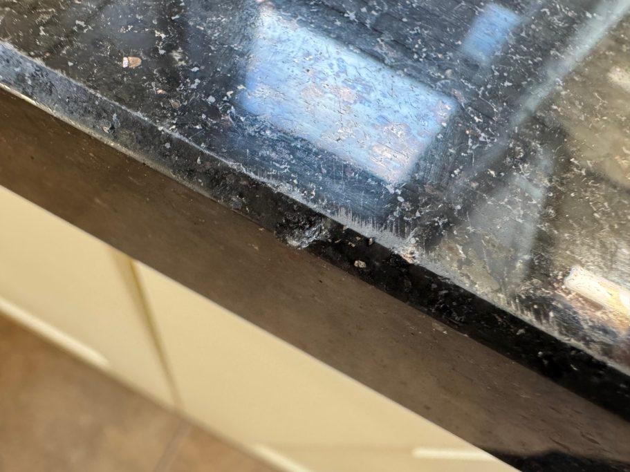 Before repair: chipped granite in Aspley Damaged edge on granite worktop in huddersfield , aspley. Worktop repair in west yorkshire.