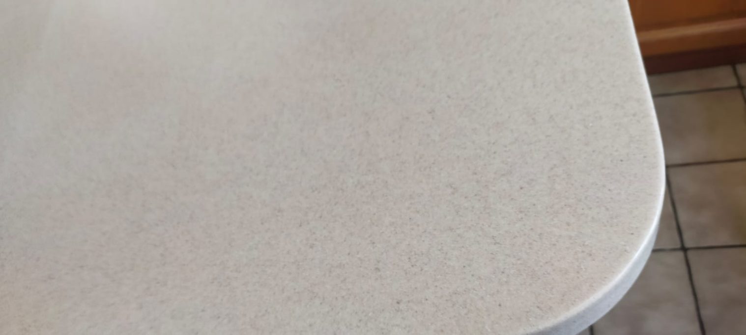 After repair: shaped Corian corner Shaped curved corian surface.