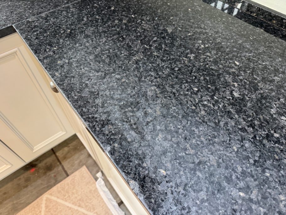 Before restoration: worn granite surface 30mm natural granite worktop with the polish warn off with 15 years of use this needed completely re-polishing.