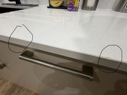 Quartz Worktop repair in East Ardsley, Wakefield area.  Damaged quartz worktop was chipped on the polished edge with 2no chunks missing.