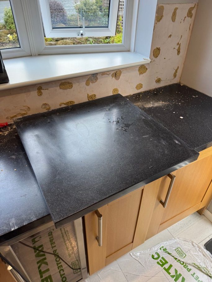 Black Corian worktop in Huddersfield Black corian worktop fitted in huddersfield ,west yorkshire. Badley scratched and repared.