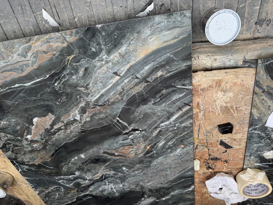 After repair: filled and polished stone tabletop Stone tabletop after filling and polishing.