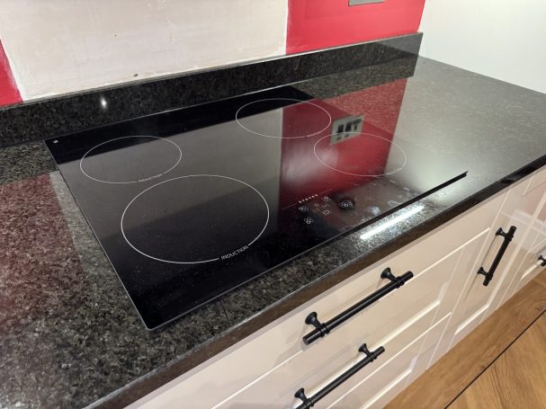 After: repaired Ubatuba granite Ubatuba granite worktop and upstand after crack repairs and polishing in Hebden Bridge, with the hob back in position.