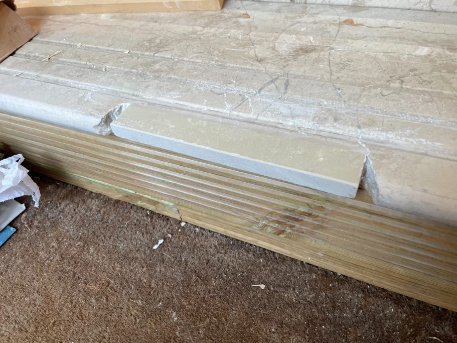 Replacement stone section fitted to steps matching marble piece put in
