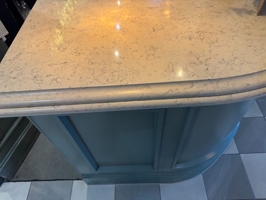 Restored bar top with ogee edge Restraunt worktop competley repolished to a high gloss. Quartz was chipped and dinted on the surface worktop repair in Greetland. Halifax.