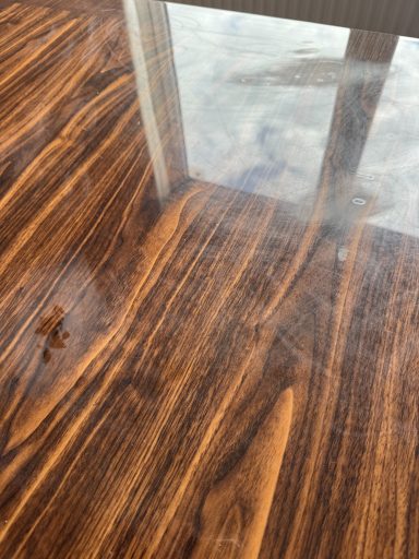 Marks and stand un scratched dining table. Wood effect dining table made in resin, the top is scratched and misty, this needs completely polishing.