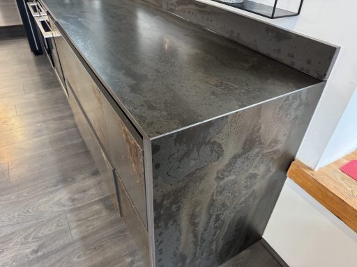 After: restored worktop end Dekton worktop end after careful resin repairs and diamond finishing in Dodworth, Barnsley.