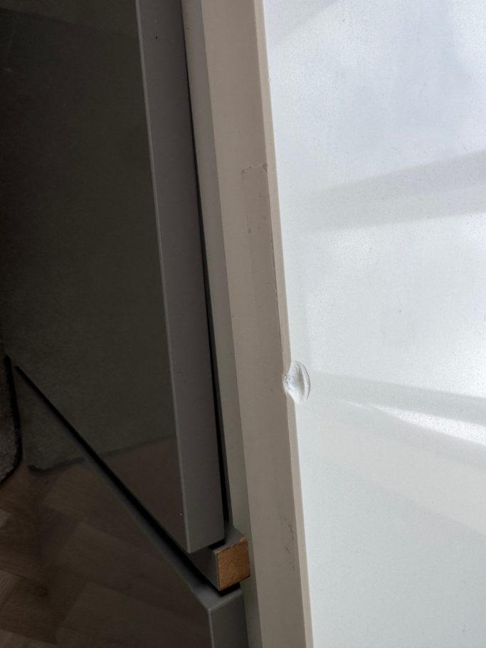 Before repair: chipped pure white quartz Damaged white quartz worktop. Quartz worktop edge with a big chip on the polished chanfer. This needs repairing. Repair in huddersfield.